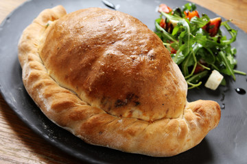 fresh baked calzone pizza