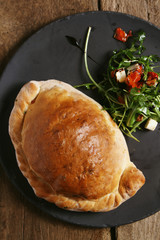 fresh baked calzone pizza