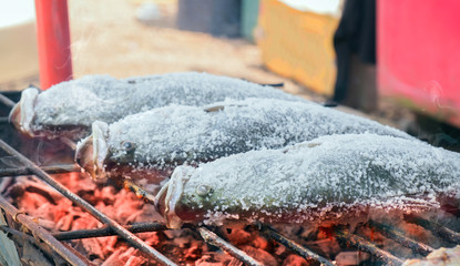 Grill fish / View of grilling fish with salt in the market. Shallow depth of field.