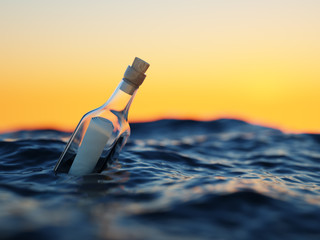 Glass bottle with letter in the sea