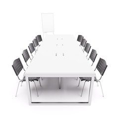 Empty conference table with flip chart
