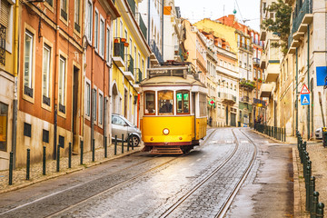 Fototapeta Classic yellow tram on a street in Lisbon, Portugal obraz