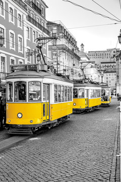 Classic yellow tram on a street in Lisbon, Portugal