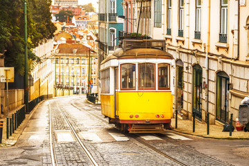 Classic yellow tram on a street in Lisbon, Portugal © Marcin Krzyzak