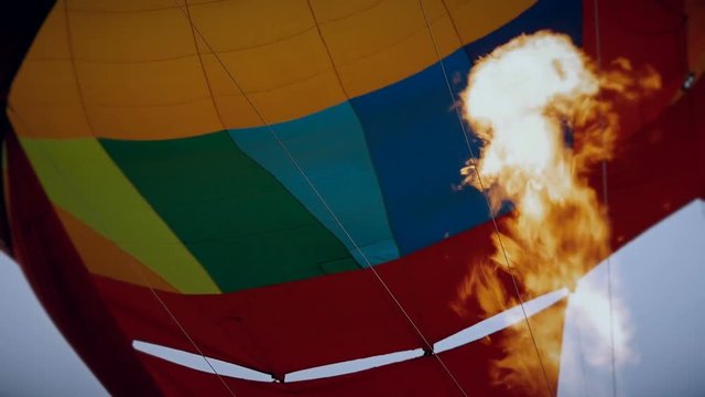 Hot air burning to the air balloon during the flight