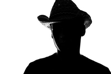young man in a straw hat - silhouette