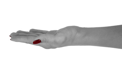 Open hand holding something, middle-aged female's skin, red manicure. Isolated on white background