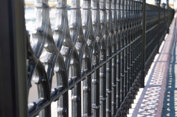 Wought iron fence with repeating pattern