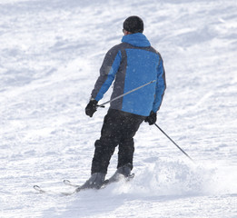 people skiing in the snow in the winter