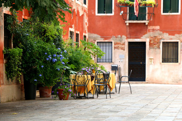 Fototapeta premium Picturesque cafe on the street in Venice, Italy.