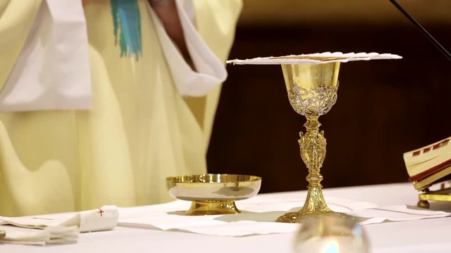Priest celebrate a mass and holy communion at the church
