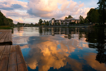August 23, 2016 Emajogi river in residential area of Tartu, Estonia. Beautiful sunset clouds...