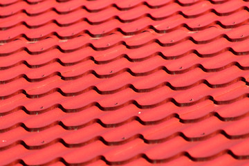 red roof tiles on the roof as a background