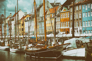 Fototapeta na wymiar COPENHAGEN, DENMARK - AUGUST 14, 2016: Boats in the docks Nyhavn