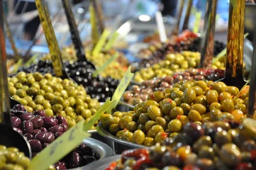Zelfklevend Fotobehang Marinated olives on street market closeup with selective focus © salita2010