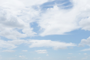 Soft white clouds with light blue sky for background