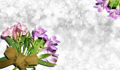 Beautiful pink and purple flowers on bokeh glitter background