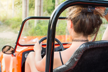 Woman driving a convertable sport car