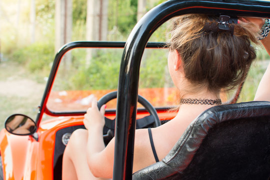 Woman Driving A Convertable Sport Car