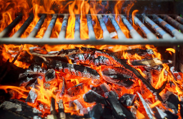 Glowing coals in a barbeque coal fire smoke