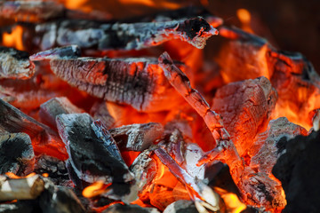 Glowing coals in a barbeque coal fire smoke