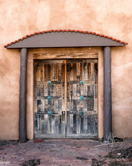wooden door with arched frame in Adobe