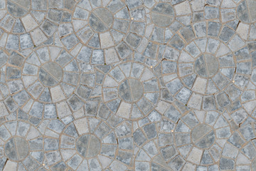 Cobble circular pattern block pavement texture background. Top view