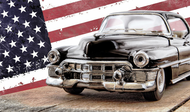 The toy car against the American flag.