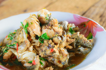 Stir-fried frog and basil on wooden