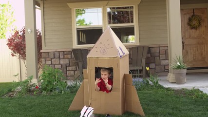 Little boy pretending to be astronaut