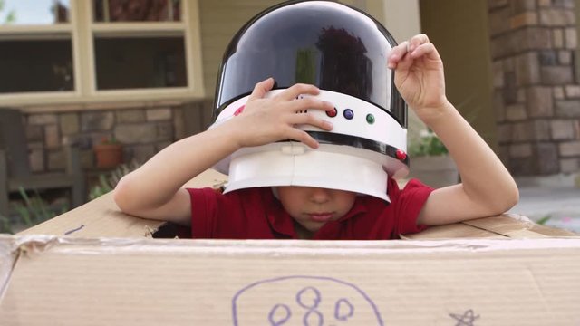 Little boy pretending to be astronaut
