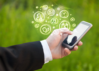 Hand holding smartphone with mobile app choices