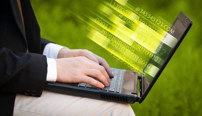 Close up of man typing on laptop computer