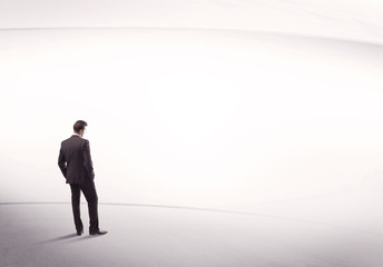 Businessman with briefcase standing still