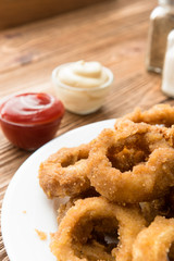 Traditional fastfood - onion rings with beer