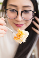 Closeup of woman eating toast