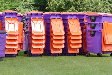 Stacks of plastic rubbish wheelie bins ready to be used at festival