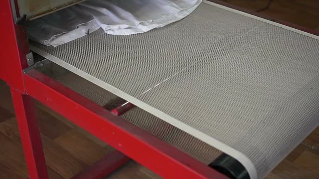 Drying machine working. Screen printing manufactury on fabric. Slide camera