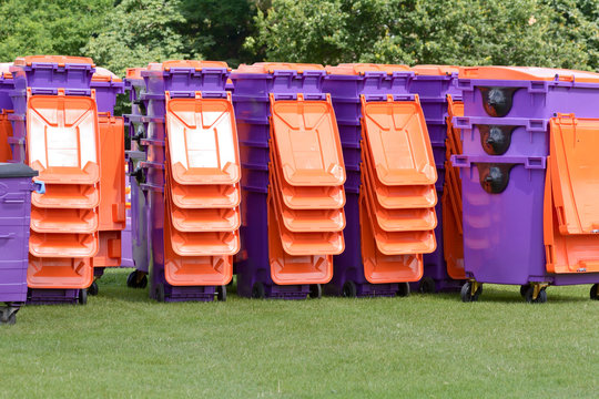 Stacks Of Plastic Rubbish Wheelie Bins Ready To Be Used At Festival