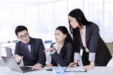 Business partners discussing in office