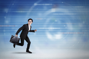 Businessman running inside cyberspace