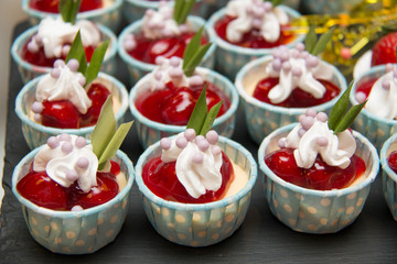 mini  cup cakes decorated cherry filling on top