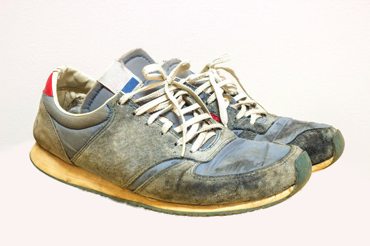Old running shoes isolate on a white background