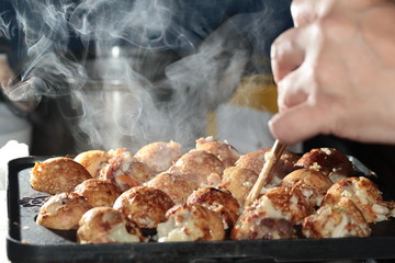 Aroma smell of hot cooking,Tokayaki grilling,home made,on selective focus.