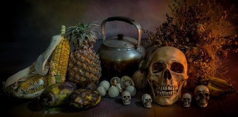 Skulls with fruit and flower rot Halloween day, Still life