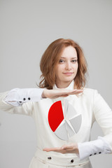 Woman shows a pie chart, circle diagram. Business analytics concept.