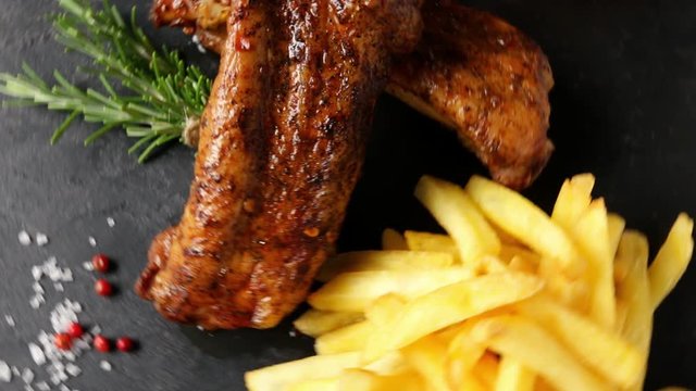 baked pork ribs with french fries and red sauce