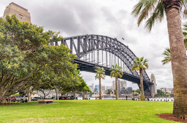 Fototapeta premium Sydney Harbour Bridge framed by vegetation - New South Wales - A