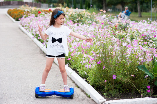 Girl Riding On The Hoverboard In The Park