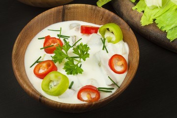 Fresh vegetables for snacks with dressing. Dip for vegetables. Healthy diet meal for dinner. Preparing vegetables in a home kitchen.
